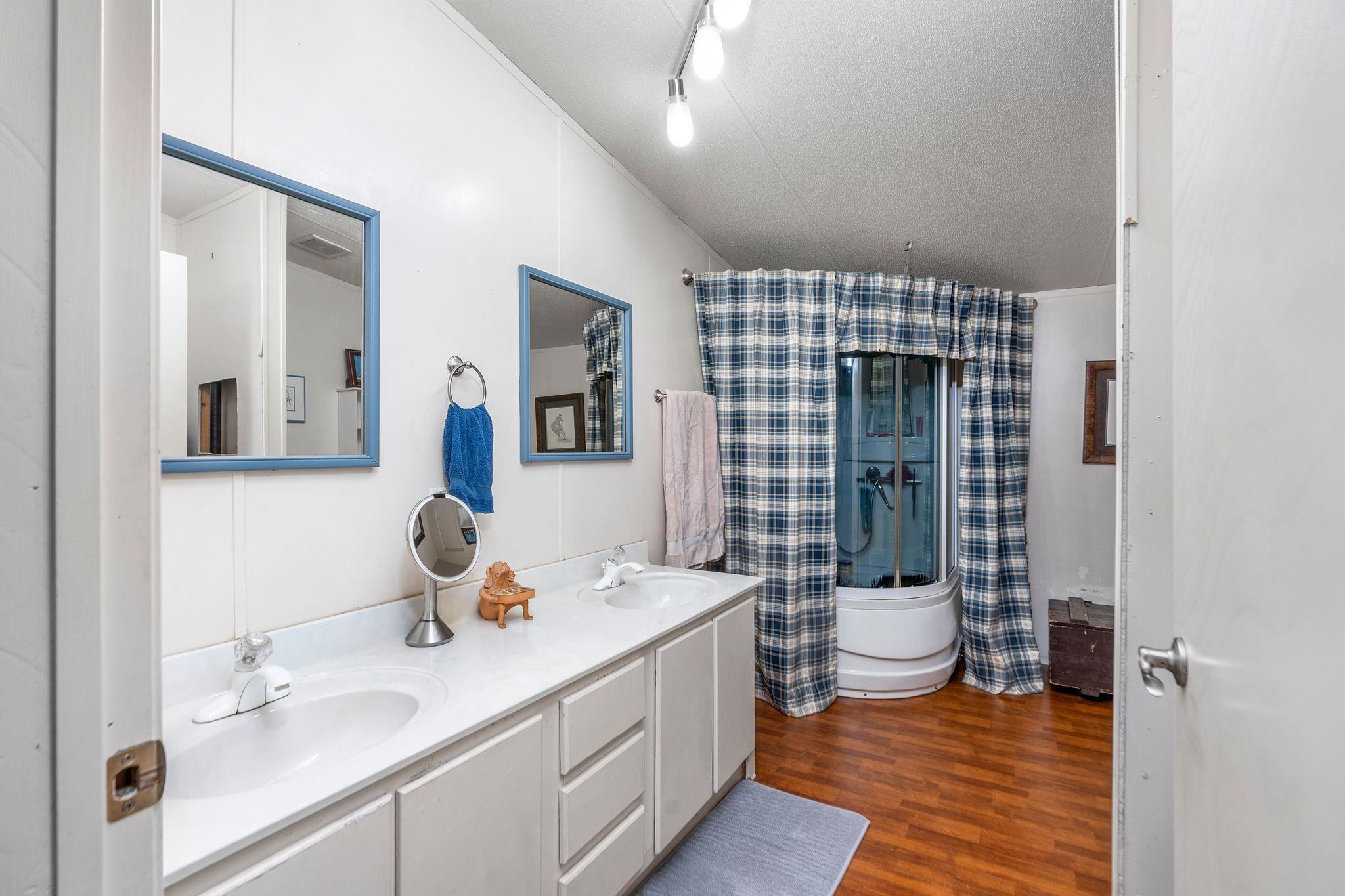 309 Old B&O Road Raphine, VA 24472 - Photo 40 of 75 a bathroom with a double vanity sink toilet and shower