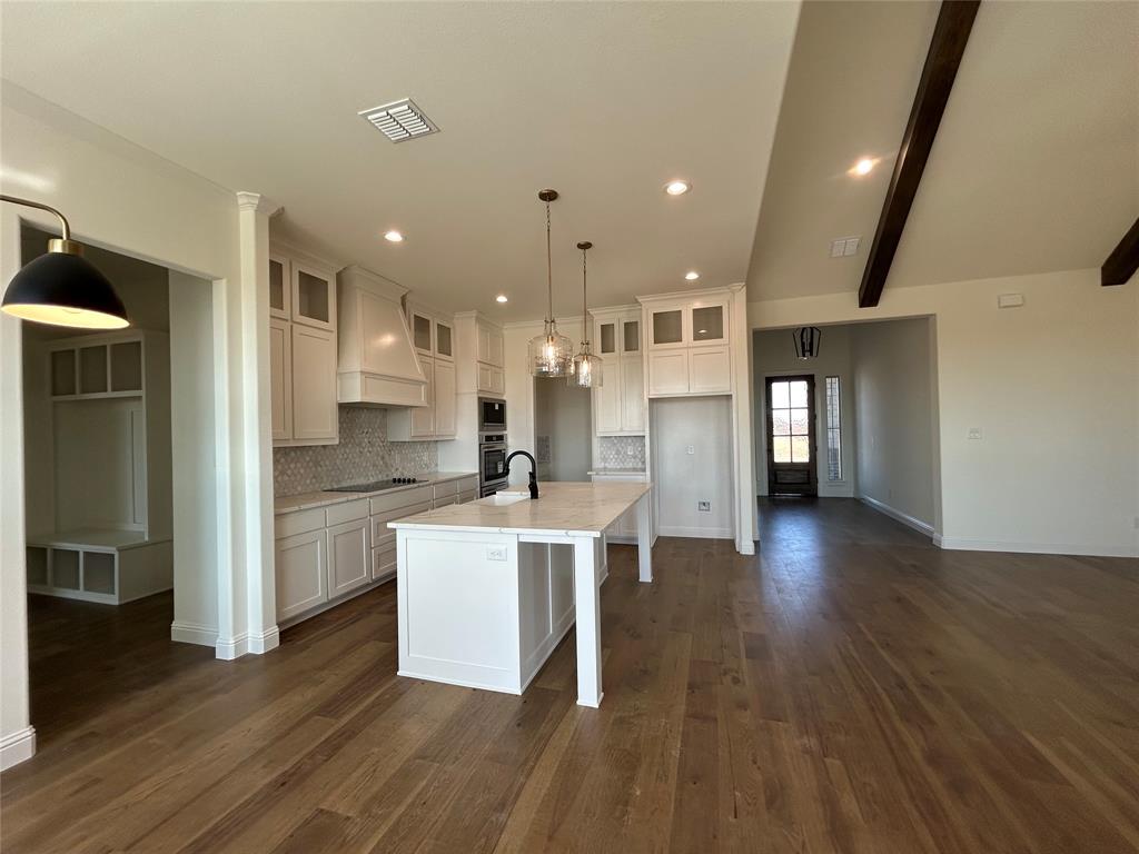 116 Blackstar Lane Decatur, TX 76234 - Photo 11 of 32 a open kitchen with white cabinets and stainless steel appliances