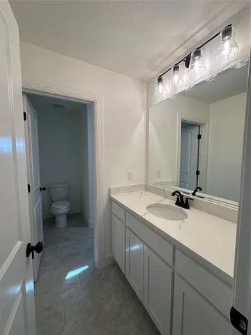 a bathroom with a toilet and a bathtub