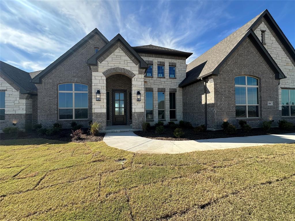 116 Blackstar Lane Decatur, TX 76234 - Photo 2 of 32 a front view of a house with a yard