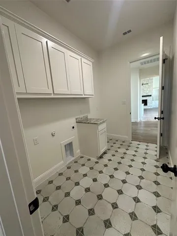 a spacious bathroom with a granite countertop sink and a bathtub