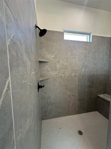 a large white kitchen with a stove and a sink