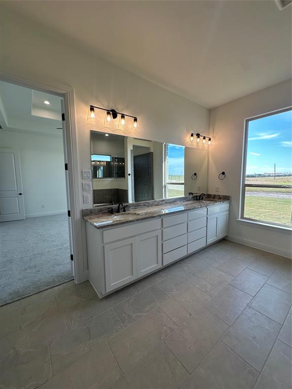 116 Blackstar Lane Decatur, TX 76234 - Photo 30 of 32 a large white kitchen with a stove and a sink