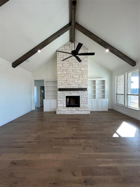 116 Blackstar Lane Decatur, TX 76234 - Photo 7 of 32 a view of an empty room with wooden floor fireplace and a window