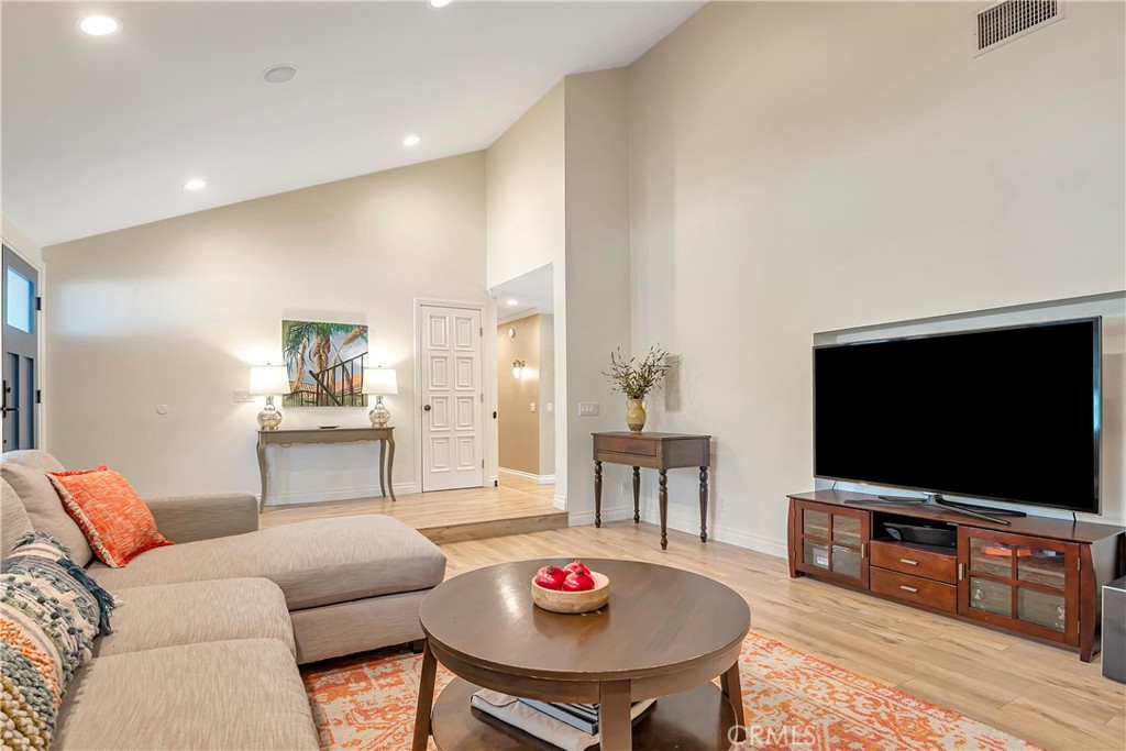 28604 Eagleton Street Agoura Hills, CA 91301 - Photo 12 of 72 a living room with furniture and a flat screen tv