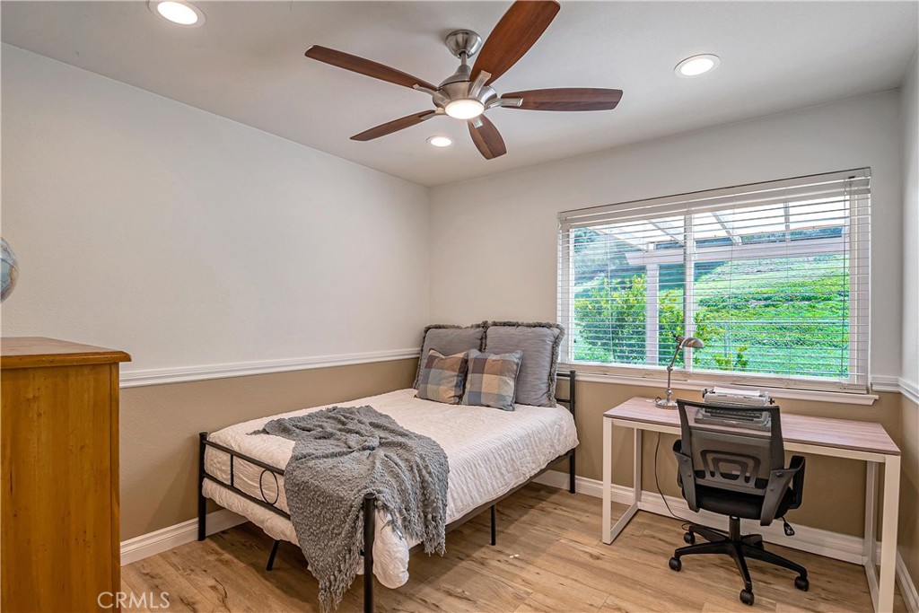 28604 Eagleton Street Agoura Hills, CA 91301 - Photo 28 of 72 a bedroom with a bed and a large window