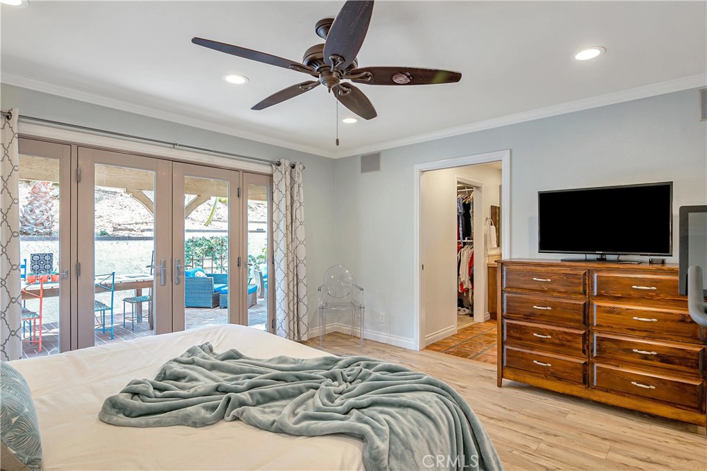 28604 Eagleton Street Agoura Hills, CA 91301 - Photo 40 of 72 a bedroom with a bed and a flat screen tv