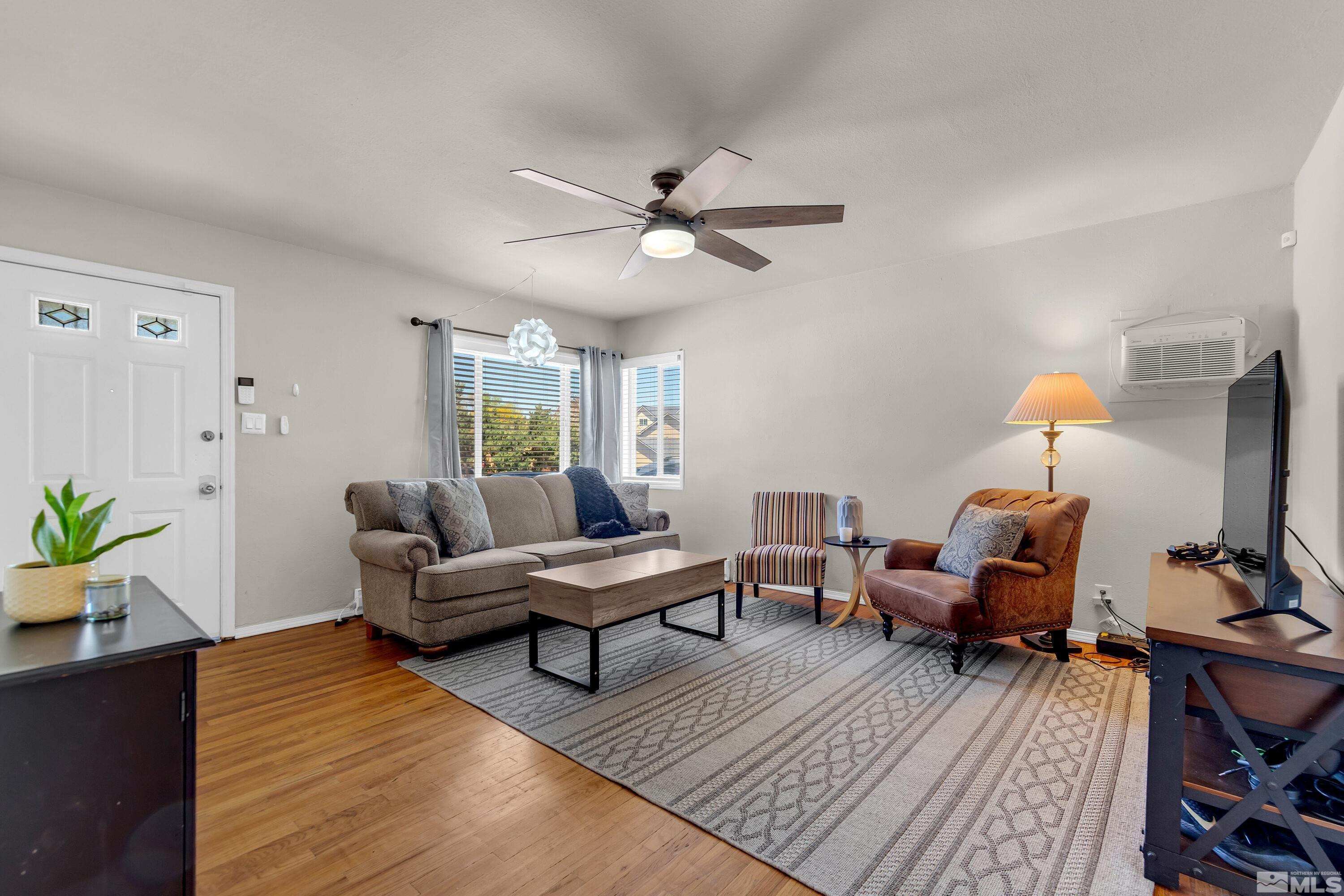1615 Keystone Avenue Reno, NV 89503 - Photo 1 of 40 a living room with furniture and a lamp