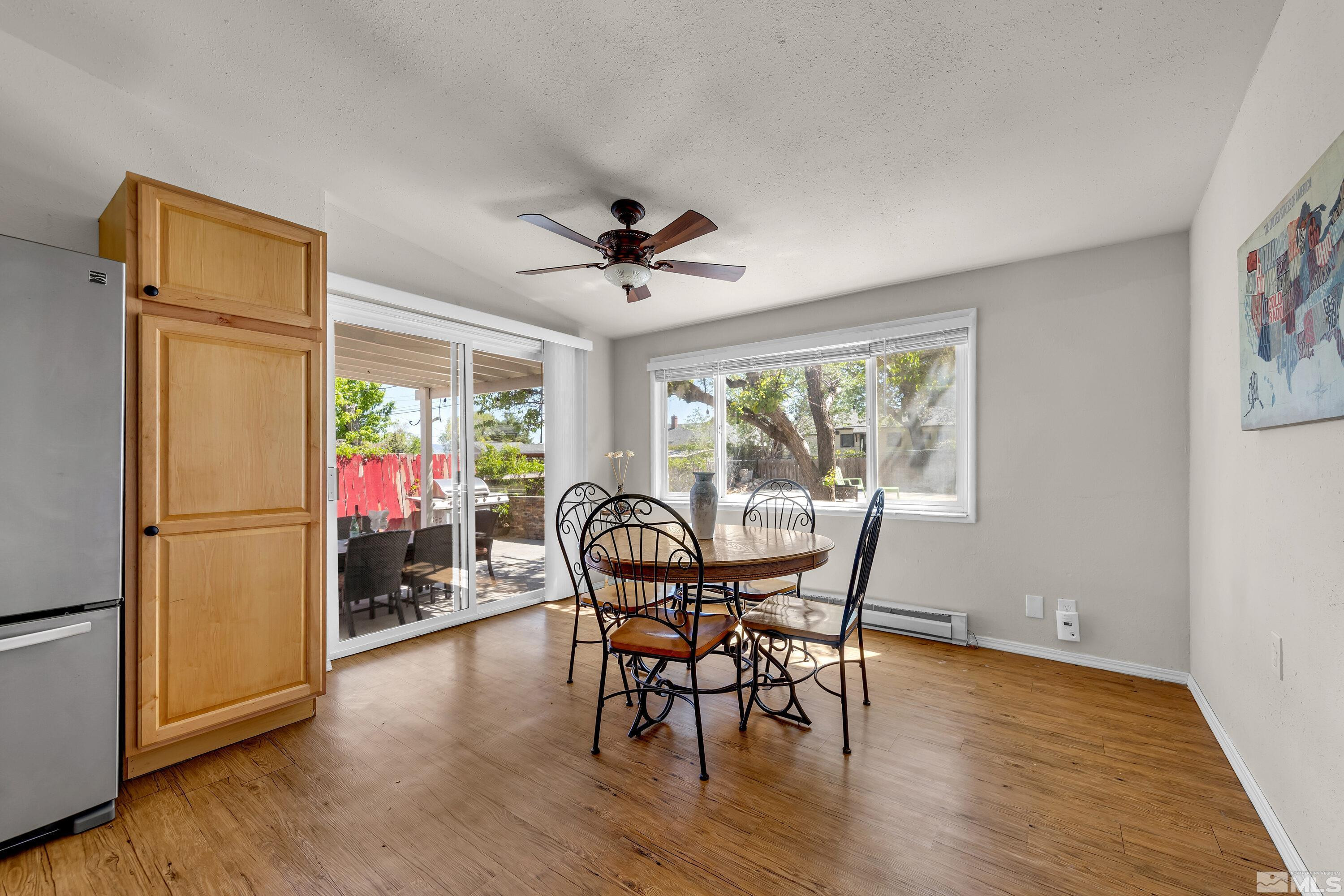 1615 Keystone Avenue Reno, NV 89503 - Photo 11 of 40 a view of a dining room with furniture window and wooden floor