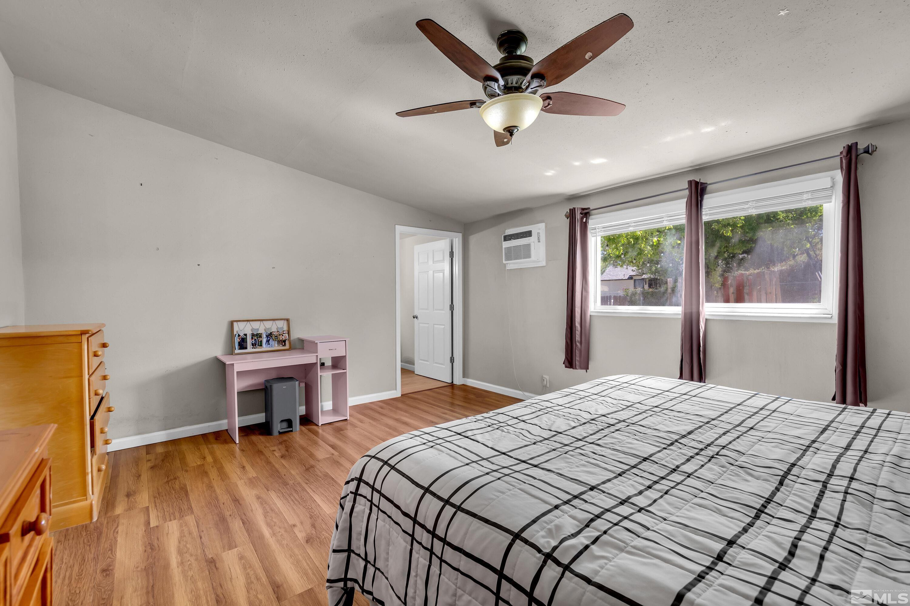 1615 Keystone Avenue Reno, NV 89503 - Photo 17 of 40 a bedroom with a bed desk and a window