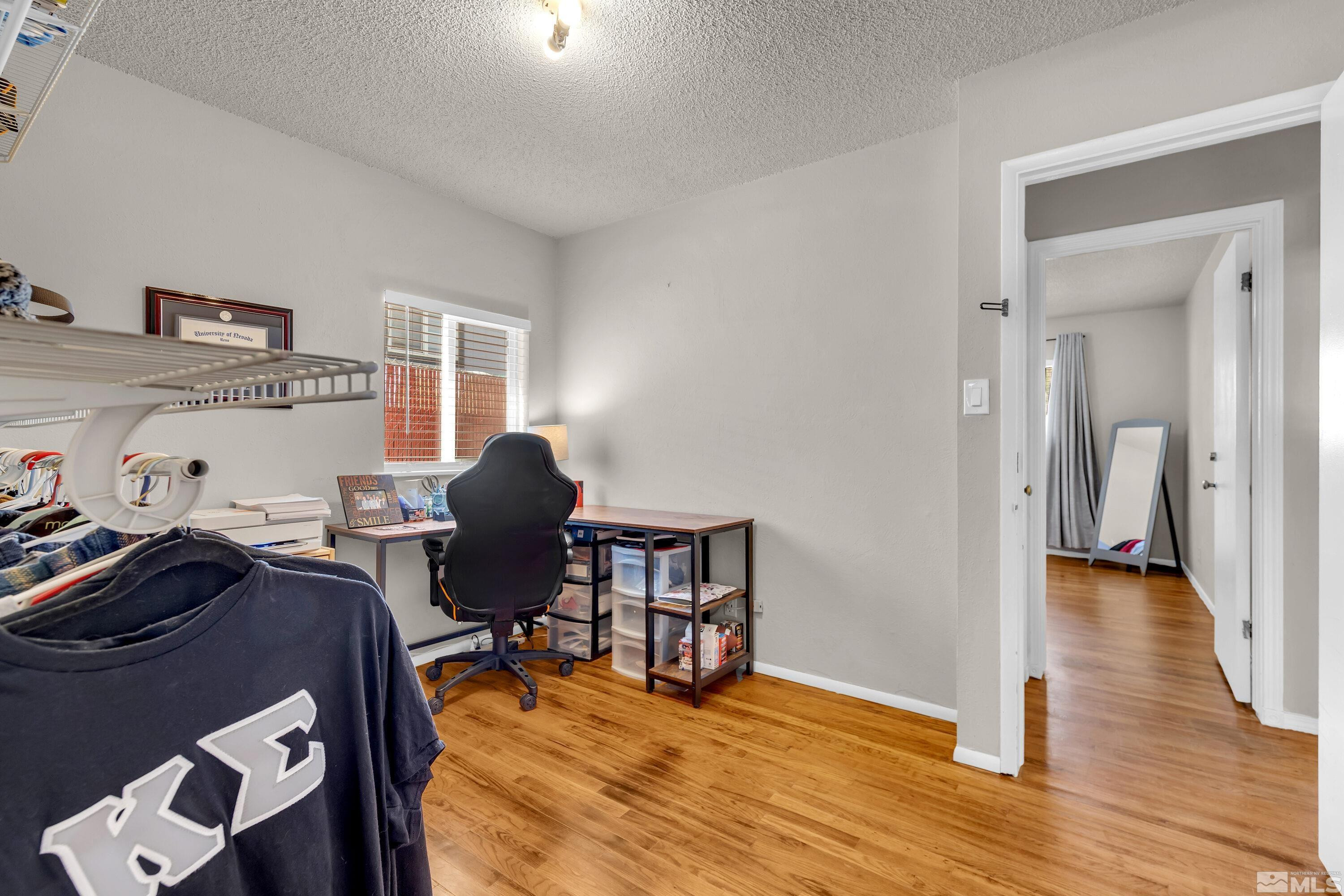 1615 Keystone Avenue Reno, NV 89503 - Photo 19 of 40 a view of a workspace with furniture and wooden floor