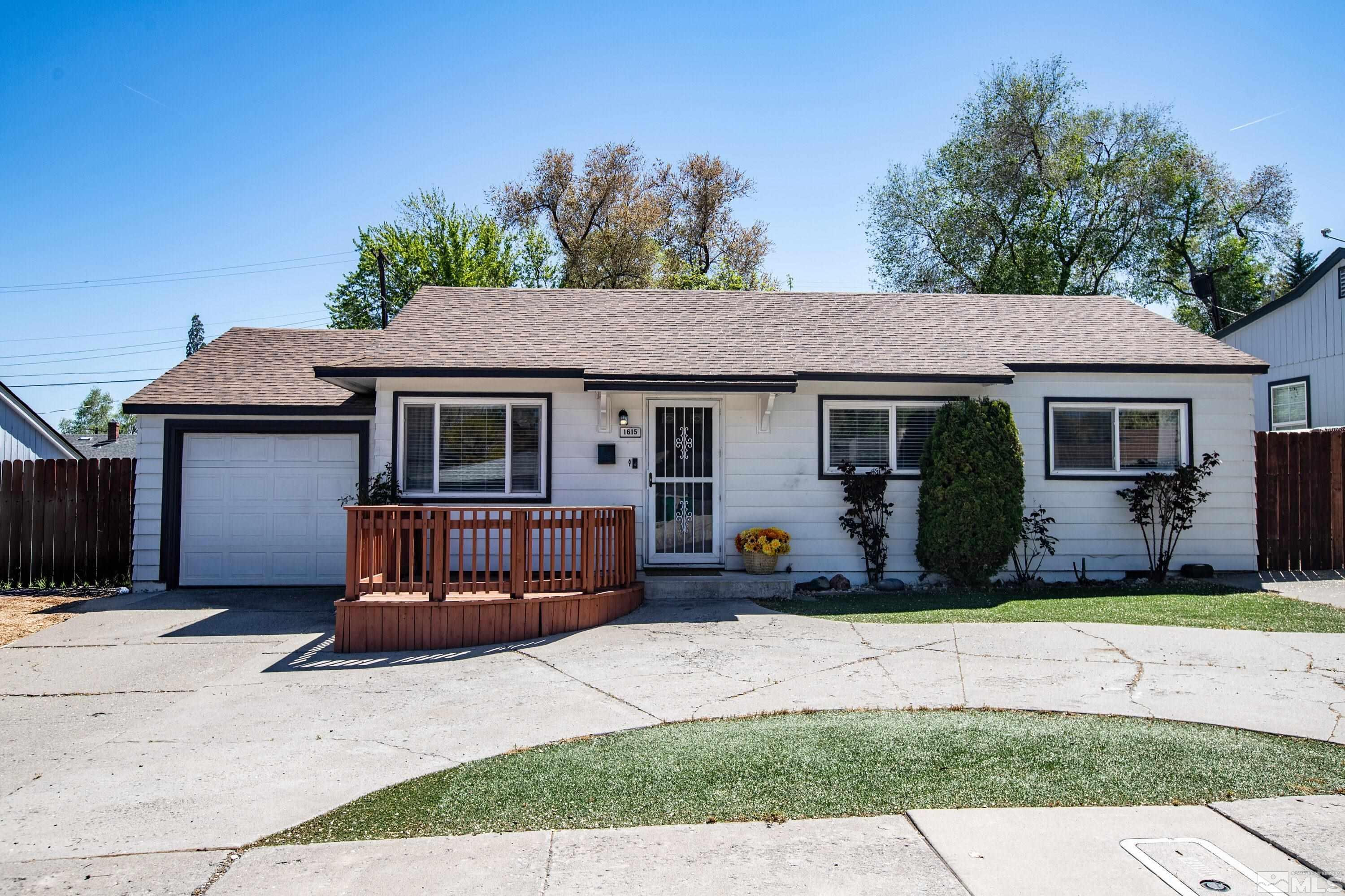 1615 Keystone Avenue Reno, NV 89503 - Photo 2 of 40 a front view of a house with a yard and glass window