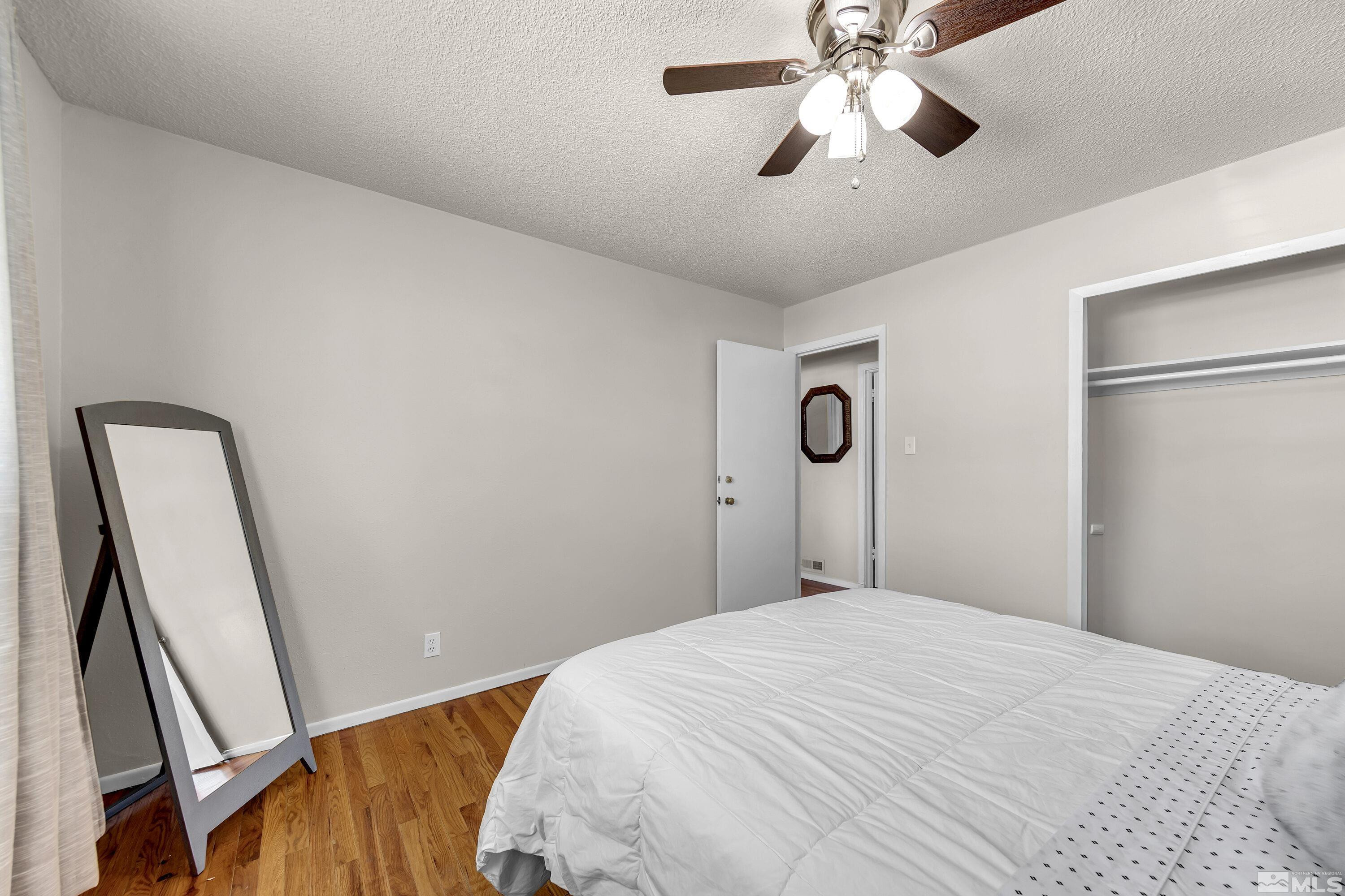 1615 Keystone Avenue Reno, NV 89503 - Photo 25 of 40 a bedroom with a bed and a mirror