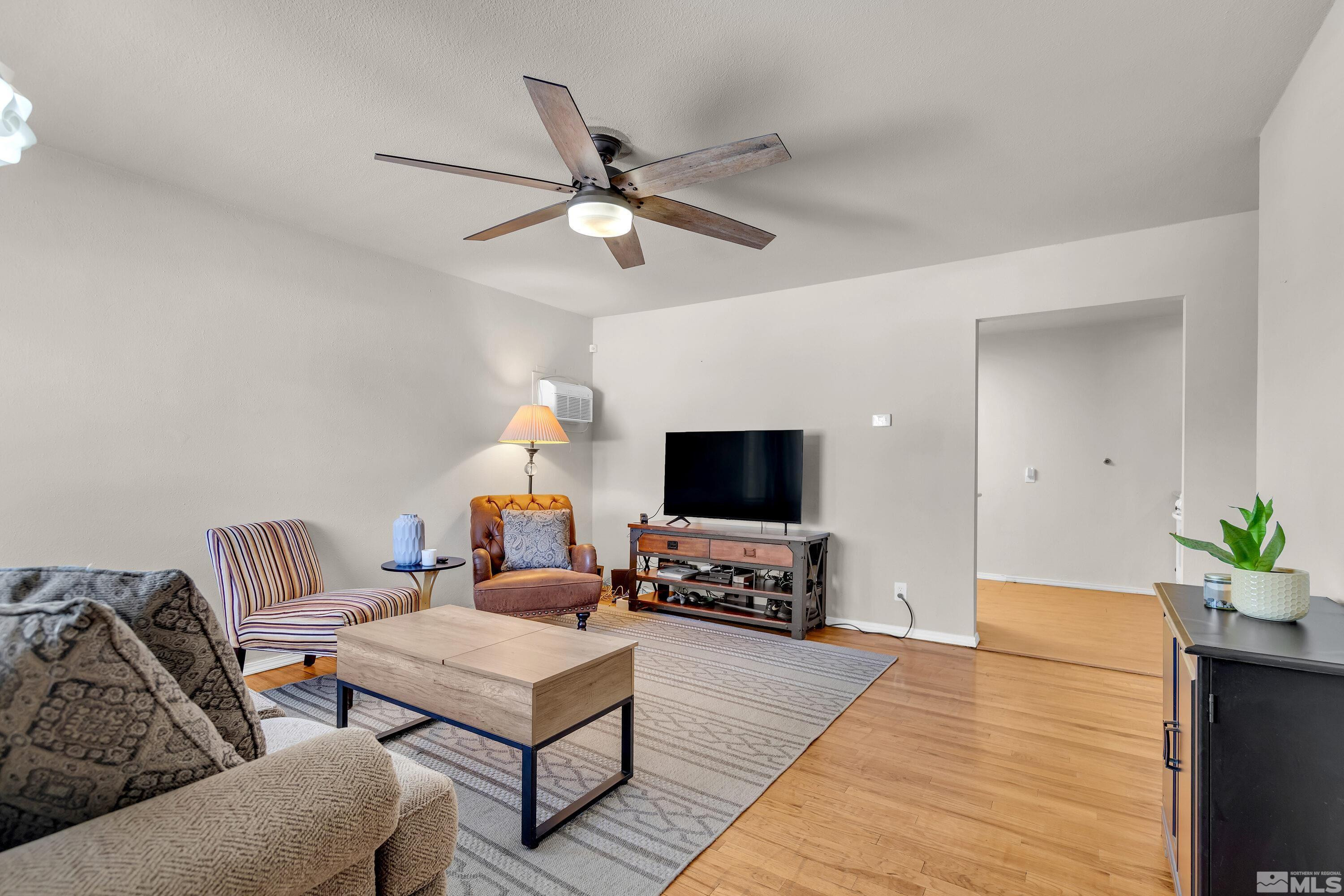1615 Keystone Avenue Reno, NV 89503 - Photo 3 of 40 a living room with furniture and a flat screen tv