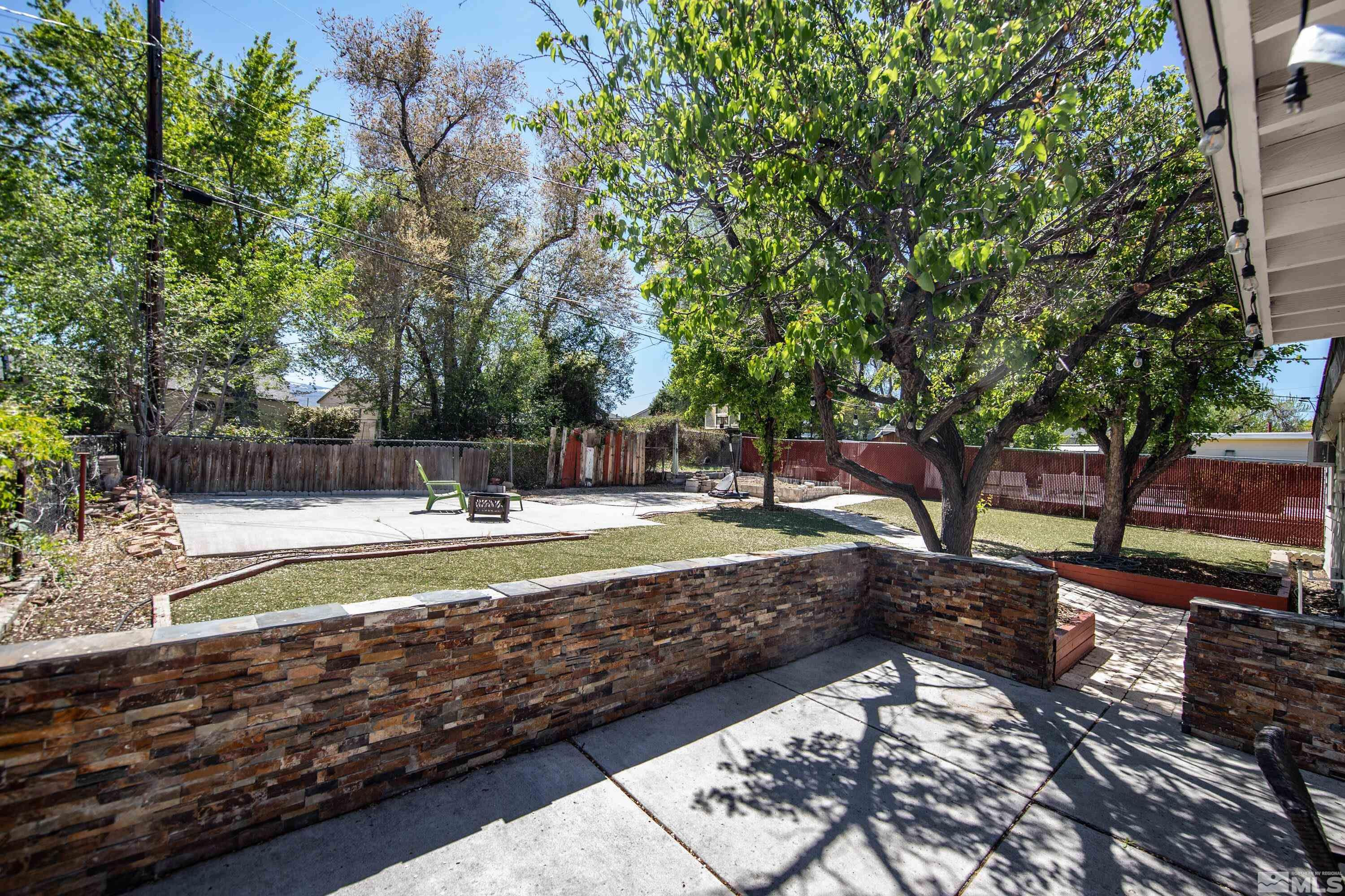 1615 Keystone Avenue Reno, NV 89503 - Photo 31 of 40 a view of a yard with large trees