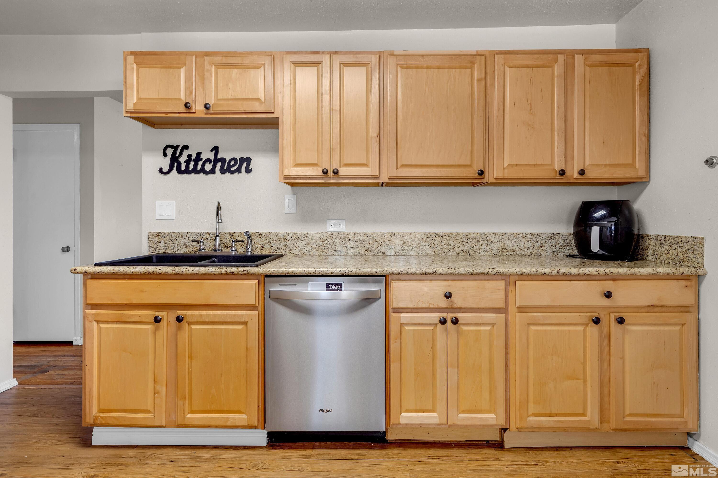 1615 Keystone Avenue Reno, NV 89503 - Photo 9 of 40 a kitchen with white cabinets and sink