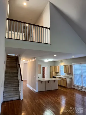 a view of kitchen with sink microwave and refrigerator
