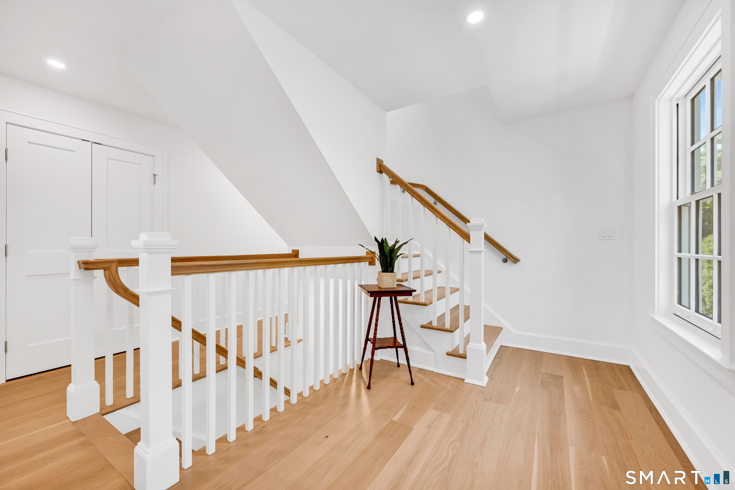920 Old Post Road Fairfield, CT 06824 - Photo 16 of 40 Upper level landing with staircase to 3rd floor