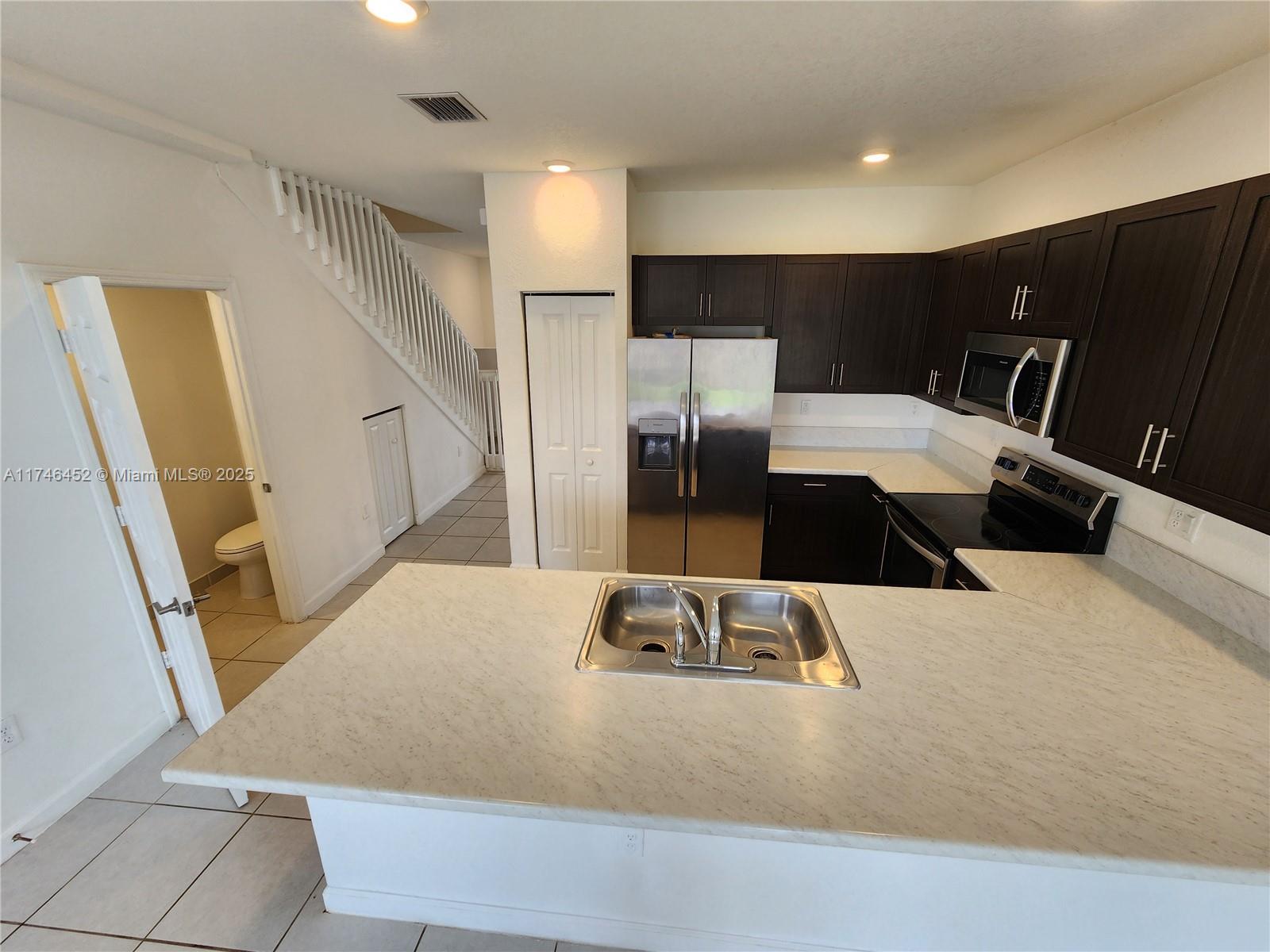18232 Southwest 148th Road, Unit 18232 Miami, FL 33187 - Photo 11 of 44 a view of a living room