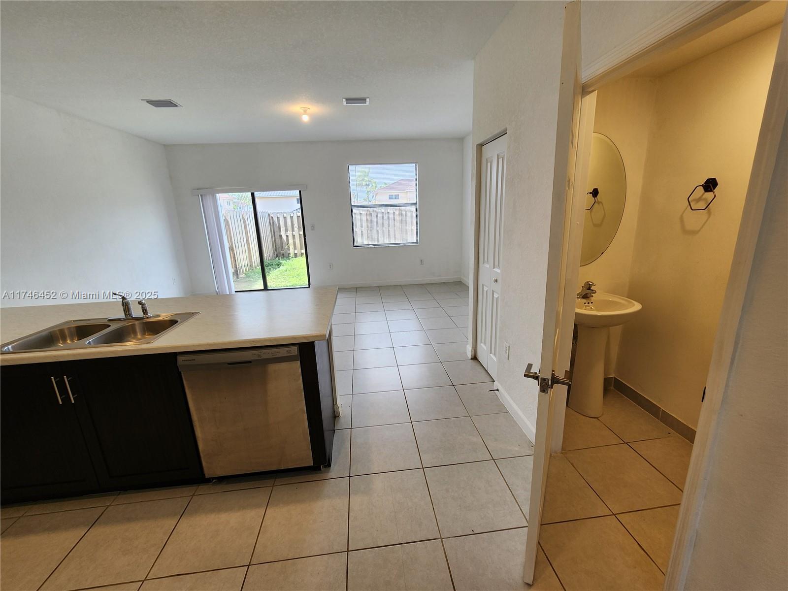 18232 Southwest 148th Road, Unit 18232 Miami, FL 33187 - Photo 12 of 44 a bathroom with a sink and a mirror