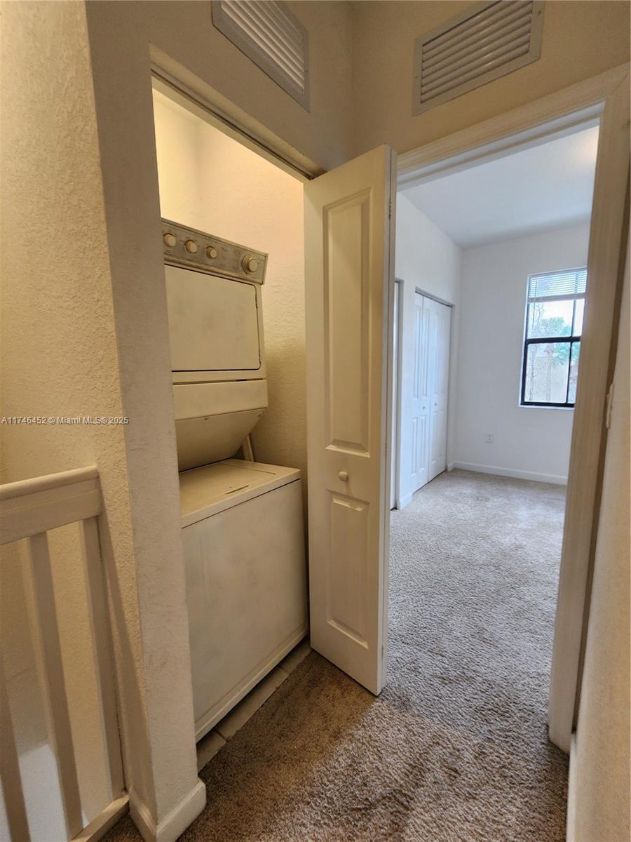 18232 Southwest 148th Road, Unit 18232 Miami, FL 33187 - Photo 18 of 44 a view of storage and utility room with washer and dryer