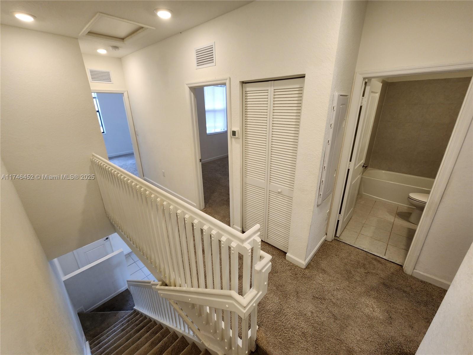 18232 Southwest 148th Road, Unit 18232 Miami, FL 33187 - Photo 20 of 44 a view of a hallway with staircase