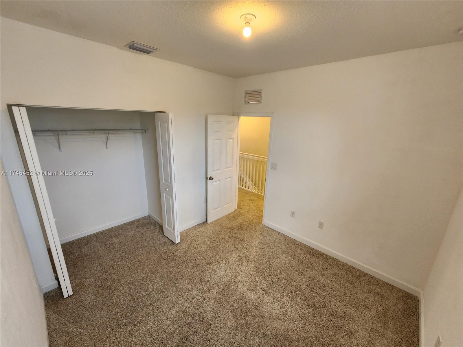 18232 Southwest 148th Road, Unit 18232 Miami, FL 33187 - Photo 22 of 44 an empty room with a bathroom and a sink