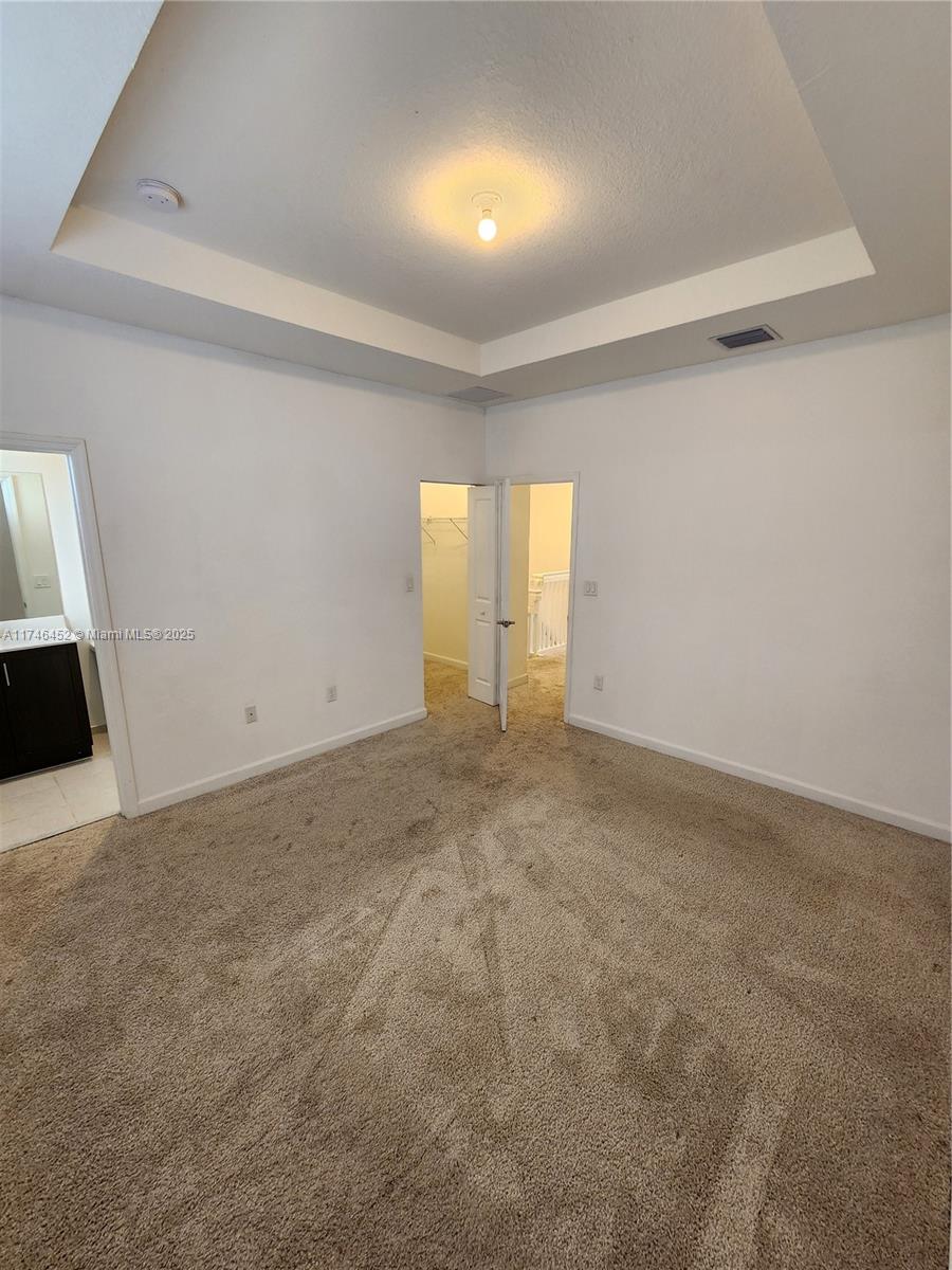 18232 Southwest 148th Road, Unit 18232 Miami, FL 33187 - Photo 26 of 44 a view of an empty room and a window