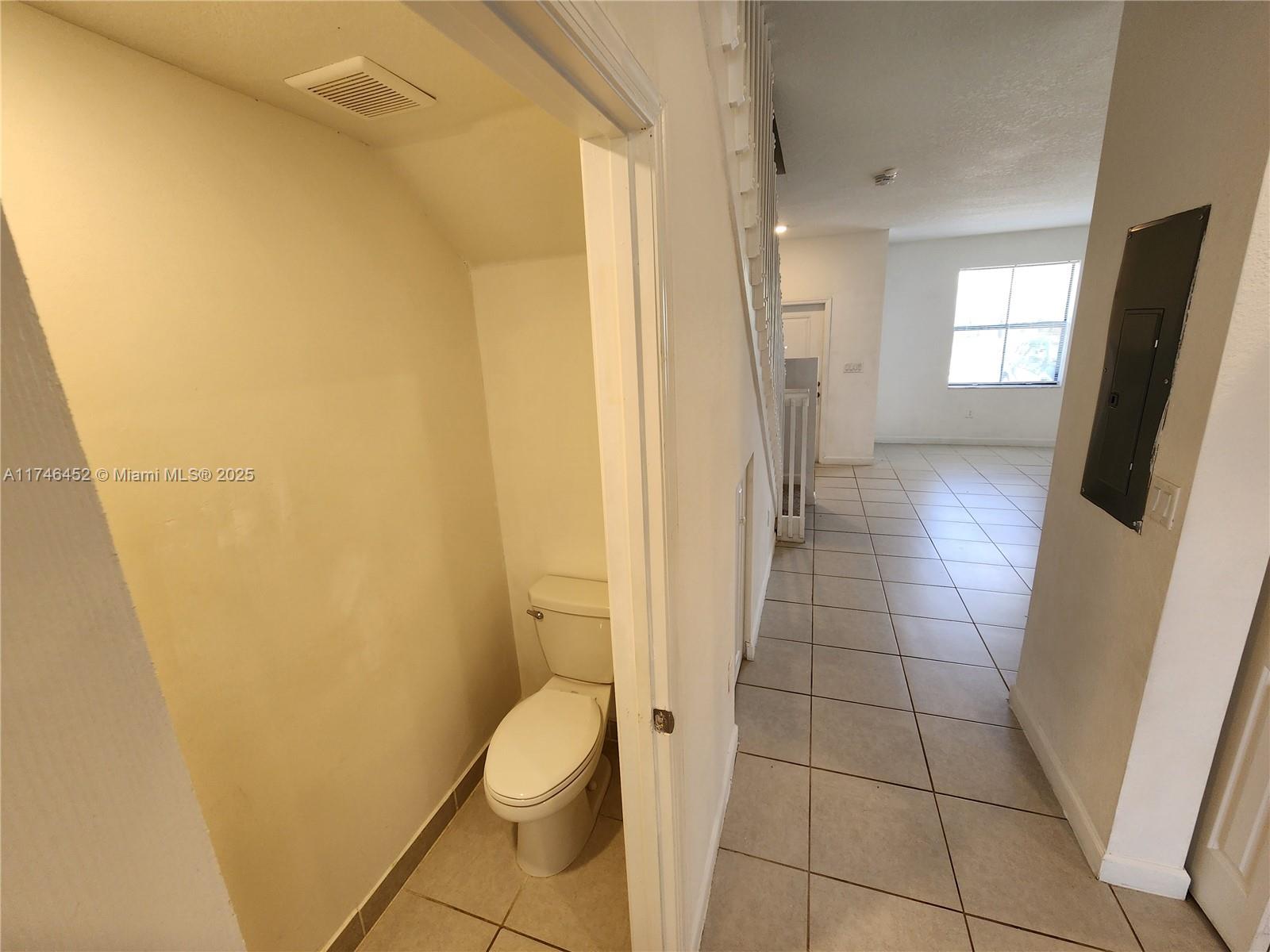 18232 Southwest 148th Road, Unit 18232 Miami, FL 33187 - Photo 30 of 44 a bathroom with a sink and toilet
