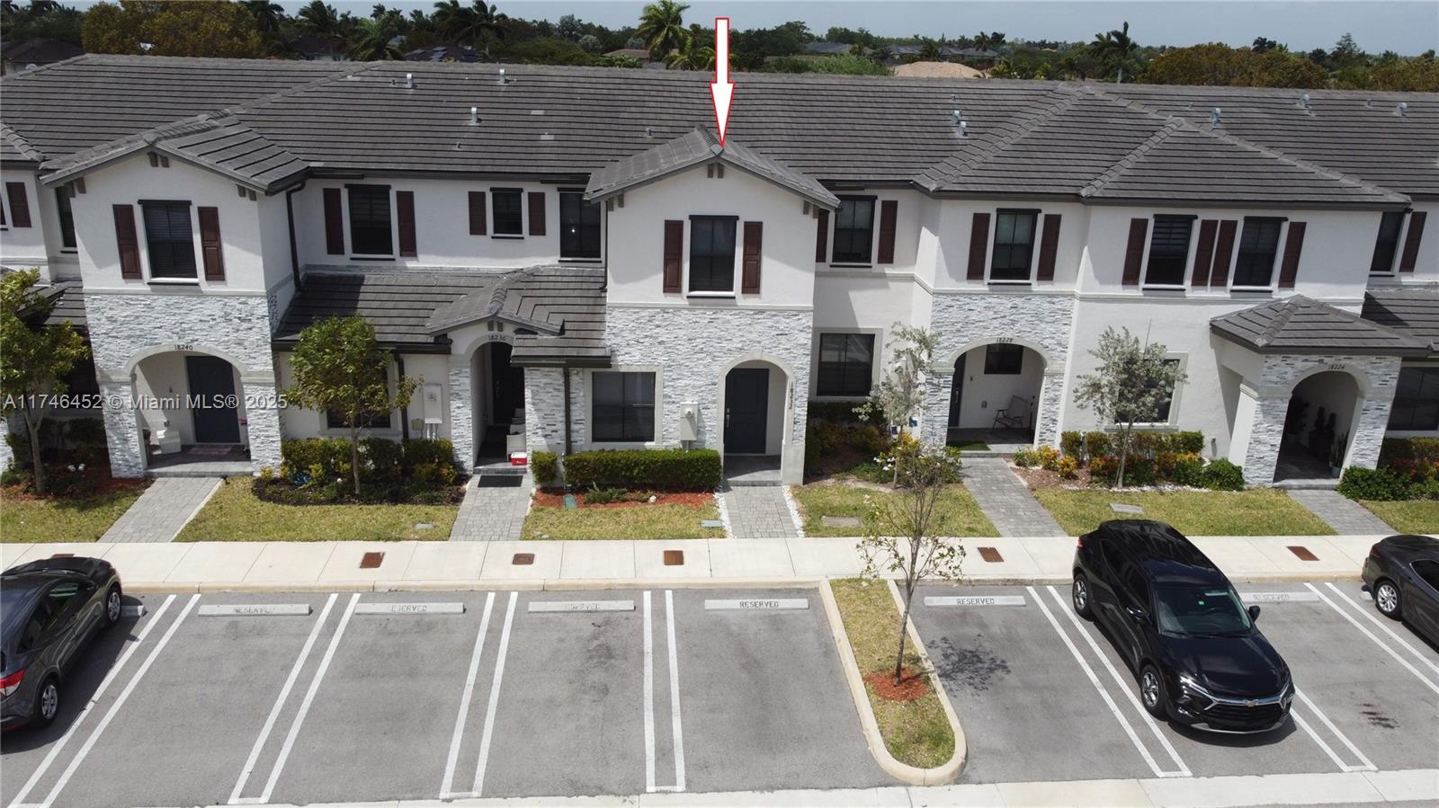 18232 Southwest 148th Road, Unit 18232 Miami, FL 33187 - Photo 3 of 44 a front view of a house with a yard
