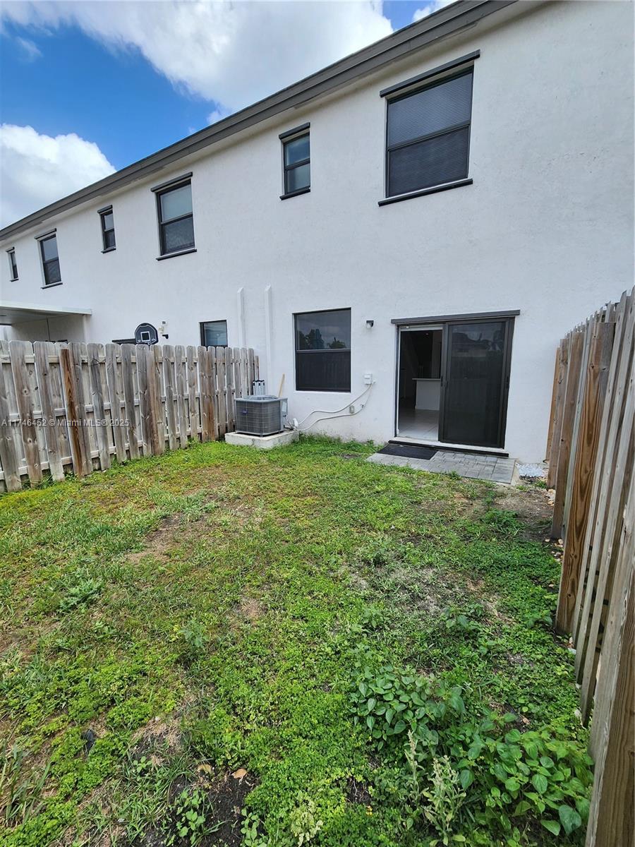 18232 Southwest 148th Road, Unit 18232 Miami, FL 33187 - Photo 32 of 44 a view of a backyard of the house