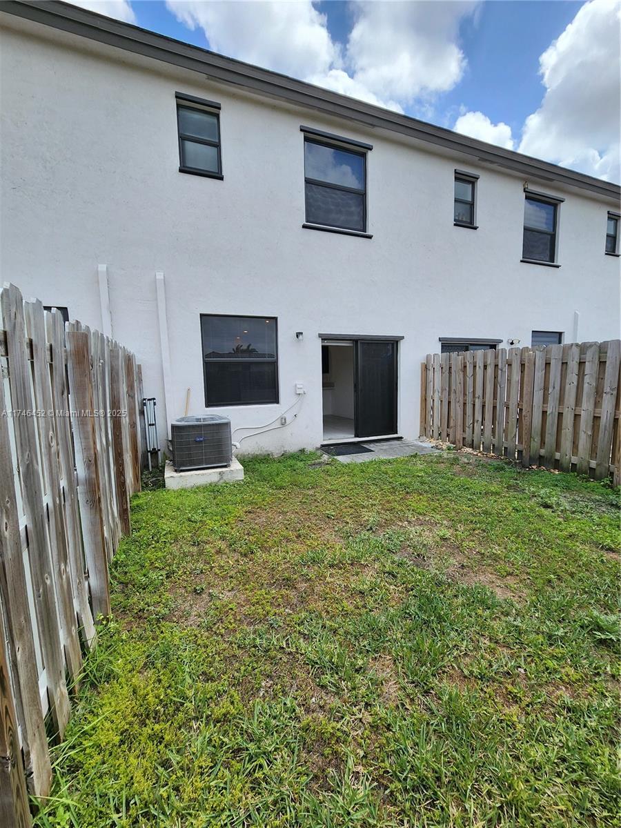 18232 Southwest 148th Road, Unit 18232 Miami, FL 33187 - Photo 33 of 44 a view of a house with backyard and porch