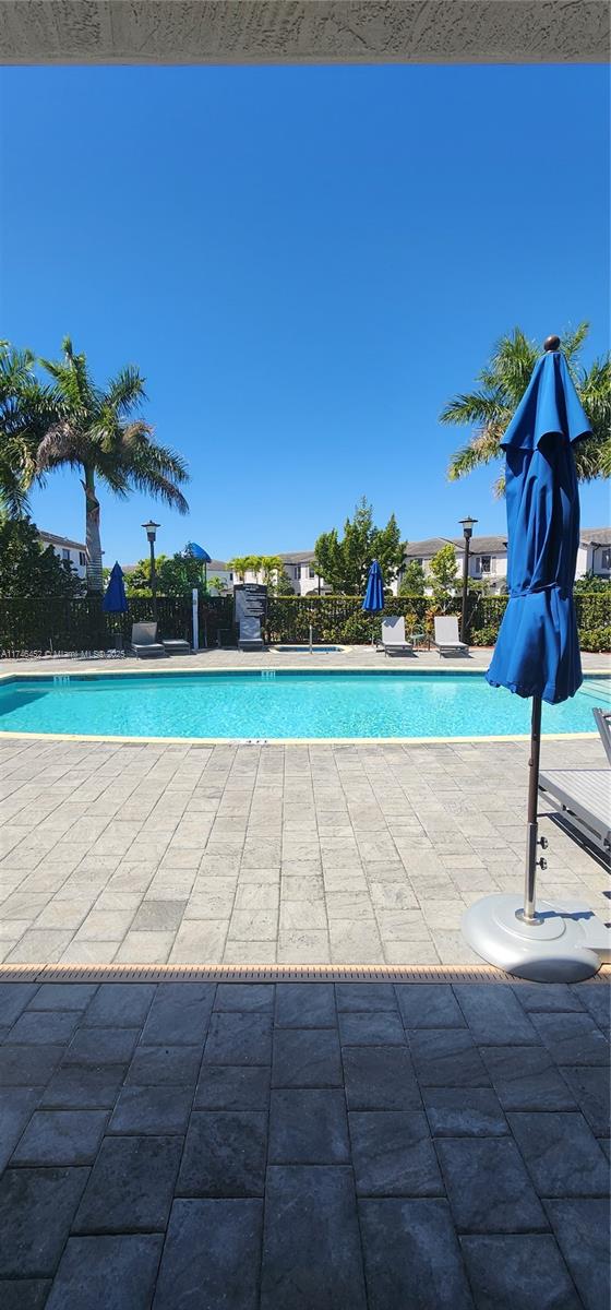 18232 Southwest 148th Road, Unit 18232 Miami, FL 33187 - Photo 35 of 44 a view of a tennis court