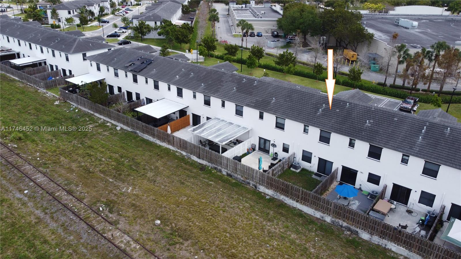 18232 Southwest 148th Road, Unit 18232 Miami, FL 33187 - Photo 41 of 44 a view of building with yard