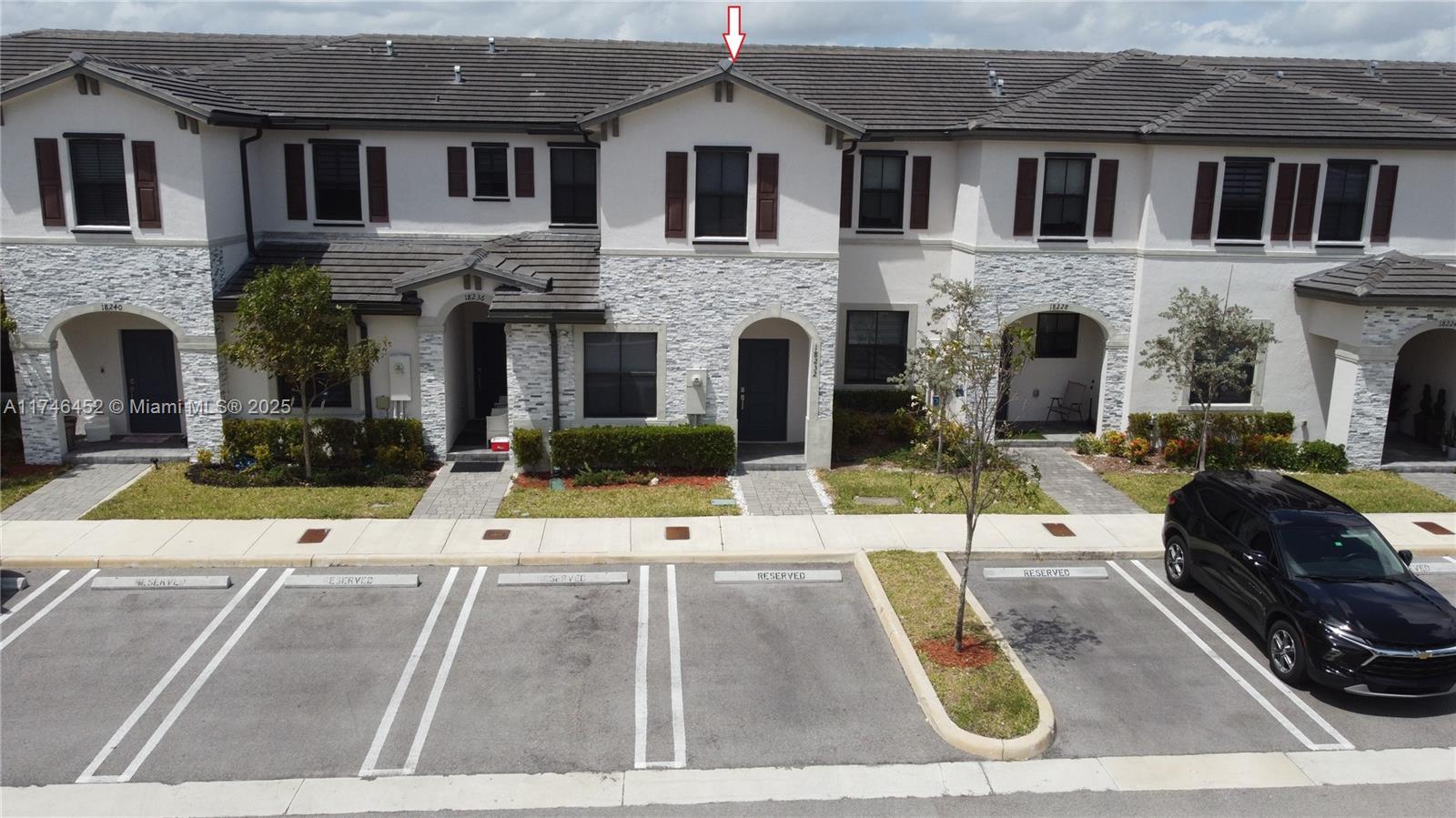 18232 Southwest 148th Road, Unit 18232 Miami, FL 33187 - Photo 44 of 44 a view of building with car parked