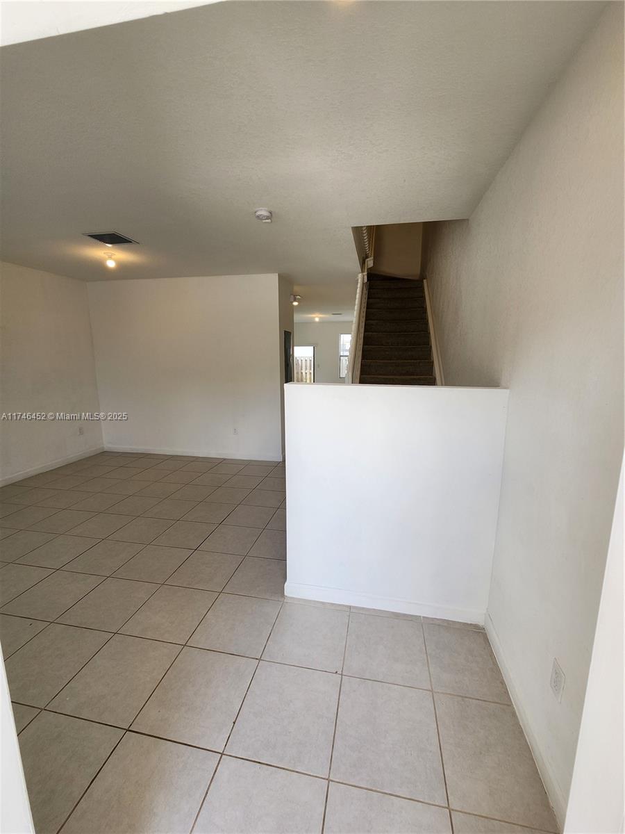 18232 Southwest 148th Road, Unit 18232 Miami, FL 33187 - Photo 5 of 44 a view of an empty room