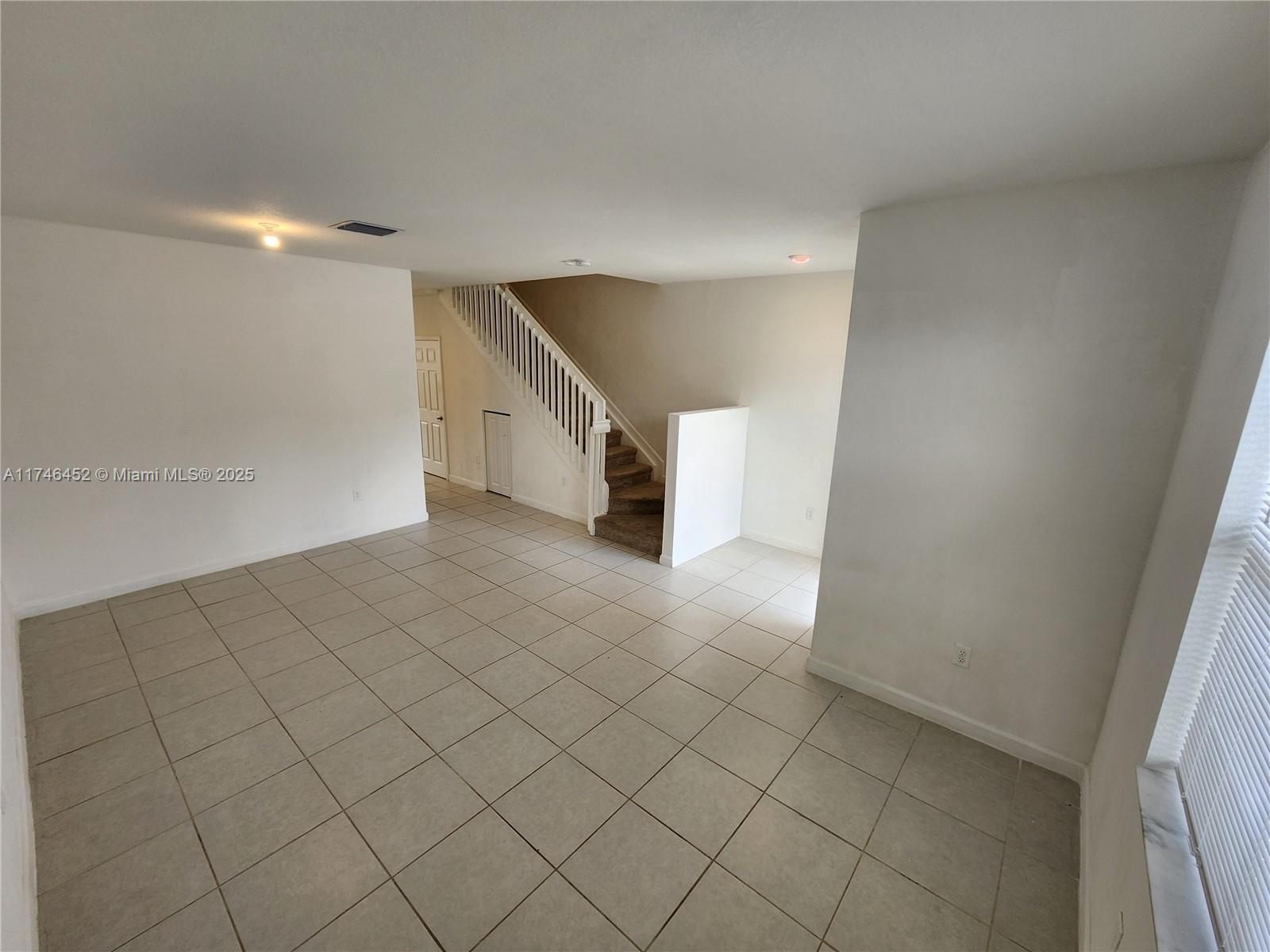 18232 Southwest 148th Road, Unit 18232 Miami, FL 33187 - Photo 6 of 44 a view of a room with window