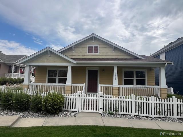 5752 Gallantry Lane Colorado Springs, CO 80923 - Photo 2 of 35 a front view of a house with a yard