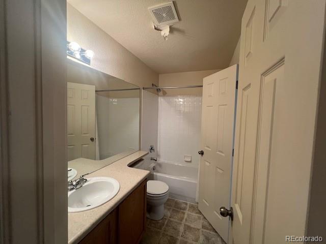 5752 Gallantry Lane Colorado Springs, CO 80923 - Photo 23 of 35 a bathroom with a granite countertop sink a toilet and shower