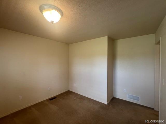 5752 Gallantry Lane Colorado Springs, CO 80923 - Photo 29 of 35 an empty room with a empty space and window