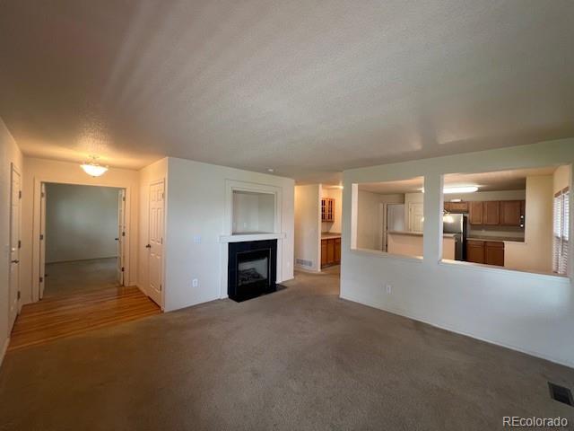 5752 Gallantry Lane Colorado Springs, CO 80923 - Photo 4 of 35 a view of a livingroom with a fireplace