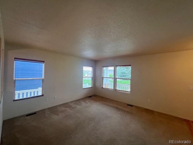 5752 Gallantry Lane Colorado Springs, CO 80923 - Photo 7 of 35 an empty room with windows