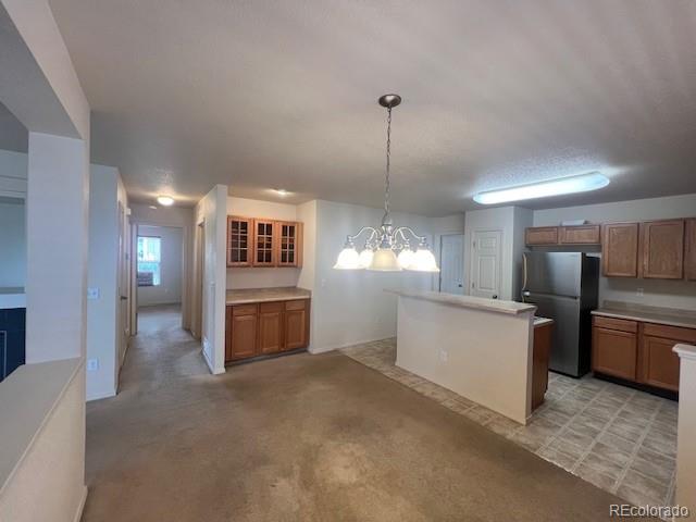 5752 Gallantry Lane Colorado Springs, CO 80923 - Photo 9 of 35 a view of a kitchen with refrigerator and windows