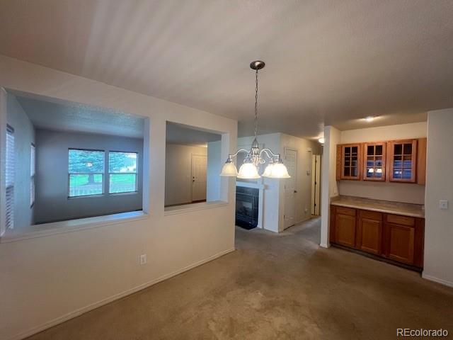5752 Gallantry Lane Colorado Springs, CO 80923 - Photo 10 of 35 a large kitchen with stainless steel appliances granite countertop a cabinets and a wooden floor