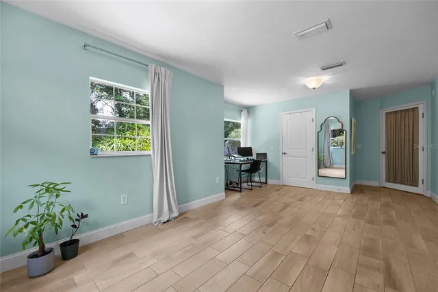 a view of an empty room with a window