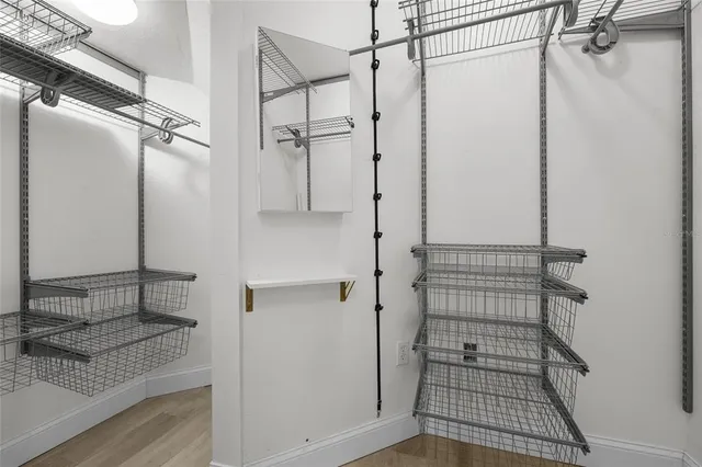 a bathroom with a shower and a sink