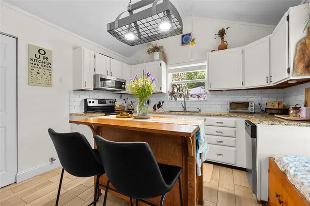 a view of kitchen with cabinets