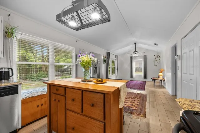 a view of a dining room with furniture window and outside view