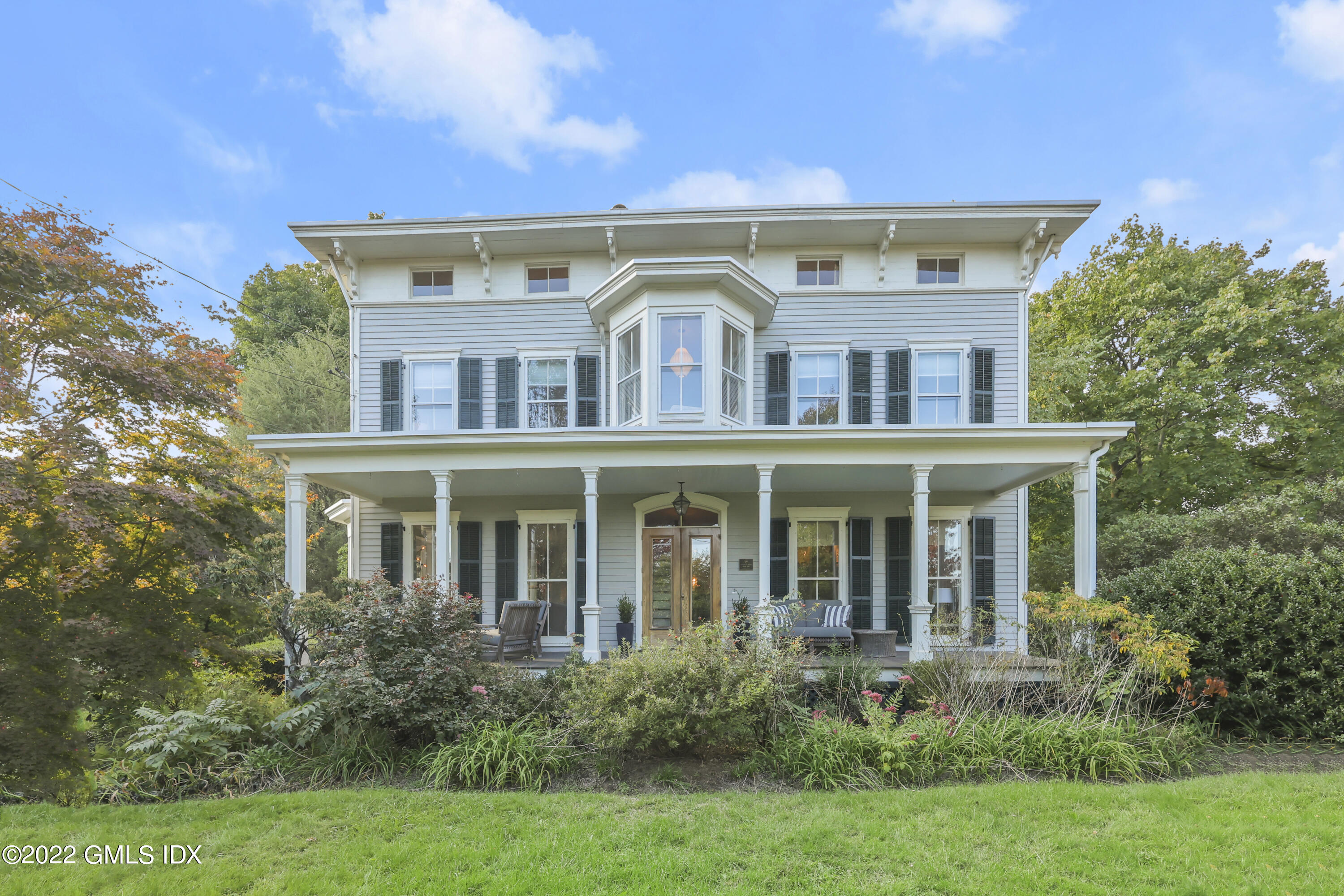 60 River Road Cos Cob, CT 06807 - Photo 1 of 31 front view of house with a yard