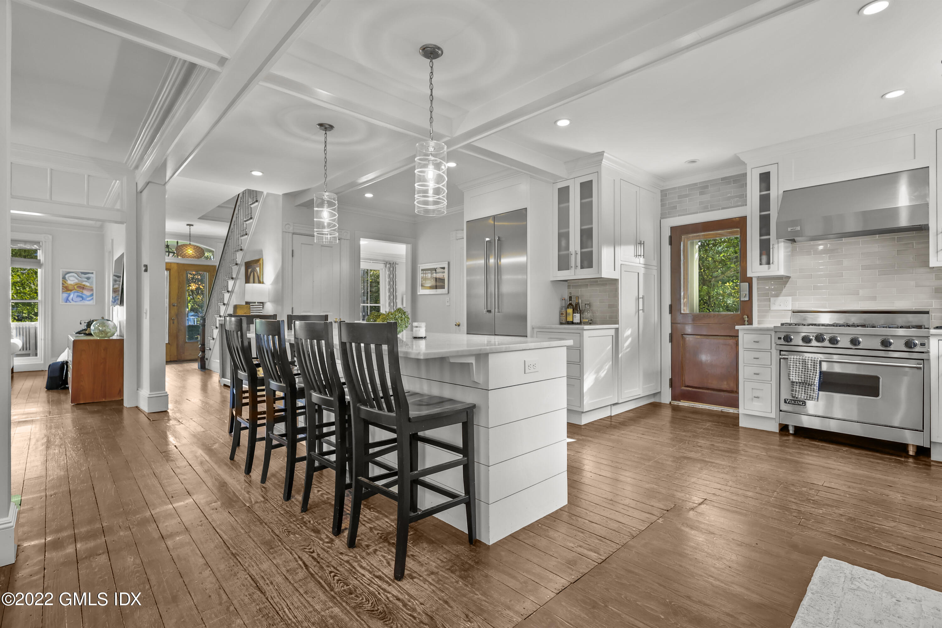60 River Road Cos Cob, CT 06807 - Photo 12 of 31 a large open kitchen with a table and chairs